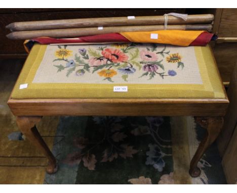 A tapestry top piano stool with a vintage kite and cricket stumps