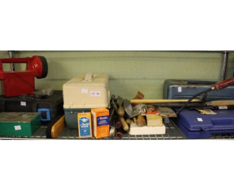 A shelf of useful modern tools including some boxed examples