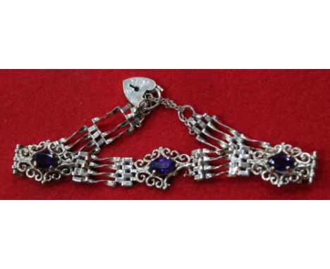 A 9ct gold gate link bracelet, purple stone set, fitted 9ct gold padlock clasp gross weight 7.9g