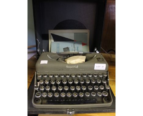 A vintage Imperial "Good Companion" Model T Portable typewriter with original instructions and guarantee&nbsp;