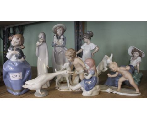 Two Wallendorf putti figures, one with lamb, one with goat, together with a collection of mainly Nao figurines (9)