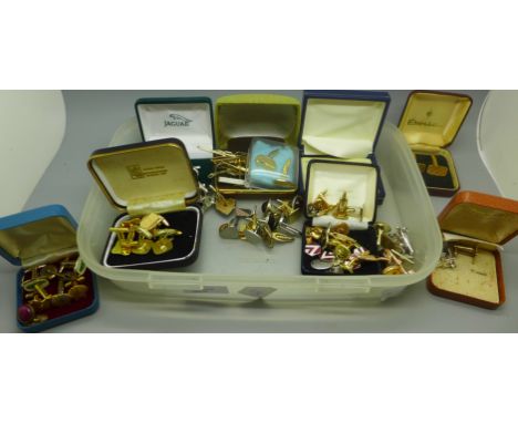 Assorted cufflinks and tie pins including Concorde and Jaguar 