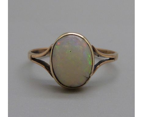 A 9ct gold and opal solitaire ring, 1.2g, J 