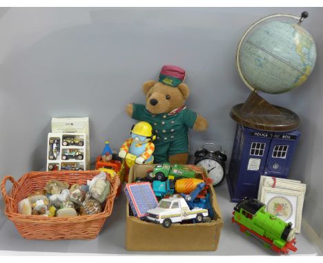 A mid 20th Century tin plate globe, a model of a Dr. Who Tardis, a Bob The Builder, Thomas the Tank Engine, etc. and resin fi