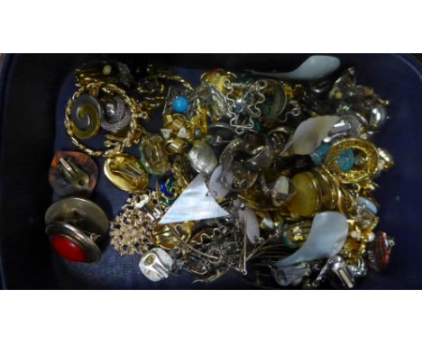 A Christian Dior case containing vintage clip-on and screw-on earrings 