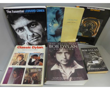 A collection of sheet music books including John Lennon, Leonard Cohen, Bob Dylan, The Rolling Stones, etc. 