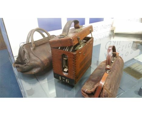 A Pigeon Clock and two bags
