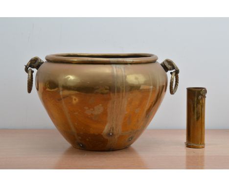 A large brass jar/planter, with two elephant drop handles (AF) 25cm H x 43cm W, together with a small brass vessel, with a lo