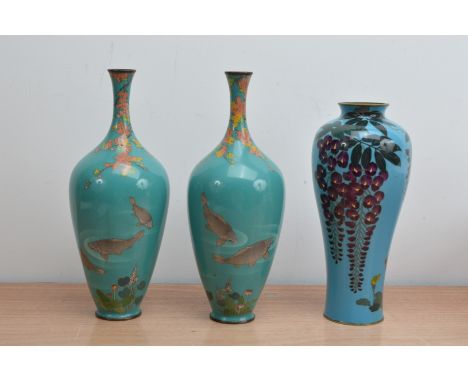 Three early to mid 20th century Japanese enamel and brass vases, a pair with narrow necks, with leaves and carp on blue/turqu