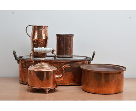 A collection of copperwares, comprising a kettle with ceramic handle and stand 24cm high, a large twin handled planter 52cm w