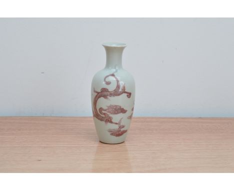 A professionally restored 19th century Chinese porcelain bottle vase, purple dragon design on a white ground, with a Kangxi c