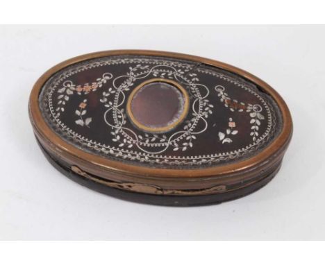 18th century oval silver and copper inlaid tortoiseshell snuff box, the hinged top with central glazed window and ribbon and 