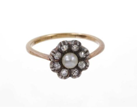 Antique pearl and diamond flower cluster ring, the central button pearl surrounded by eight old cut diamonds in silver settin