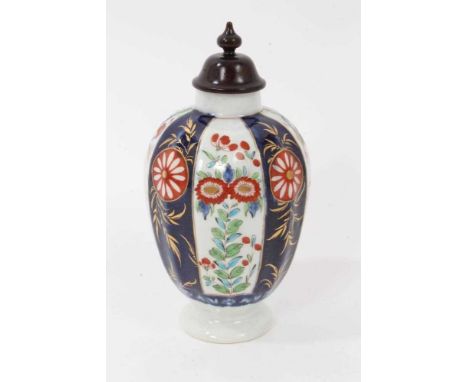 A Worcester tea canister, circa 1770, of fluted form, decorated in Kakiemon style with panels of flowers and foliate patterns