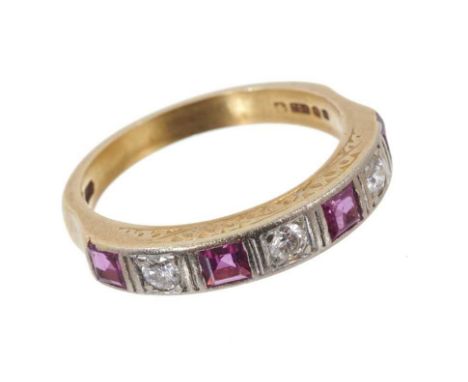 Ruby and diamond seven stone eternity ring with with four square step cut rubies interspaced by three brilliant cut diamonds 