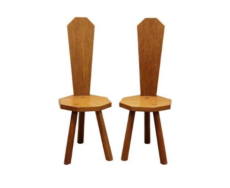 Pair of Robert Mouseman Thompson carved oak side chairs, each with high tapered slab back and octagonal seat on facetted supp