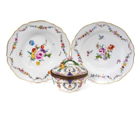 Two Meissen deep dishes, circa 1775, polychrome painted with floral sprays and swags, with gilt painted scalloped rims, cross