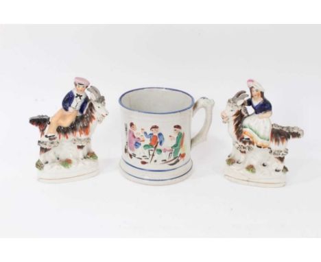 Pair of Victorian Staffordshire figures of children on goats, together with a pottery frog mug (3)Condition report: The mug h