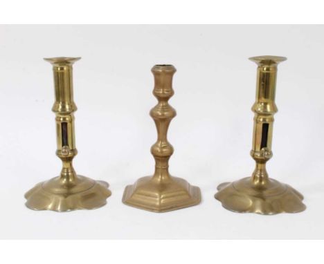 Pair of brass early 18th century candlesticks with ejector stems and shaped bases, 17cm high, together with a single Queen An