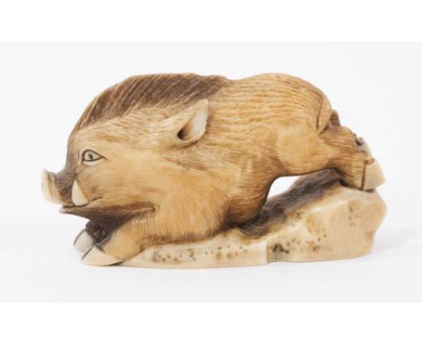 Late 19th century Japanese carved ivory netsuke in the form of a running boar, signed 6.5cm