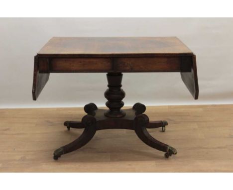 Regency rosewood sofa table, rectangular drop leaf top with canted angles, with single drawer to end and reel moulded frieze,