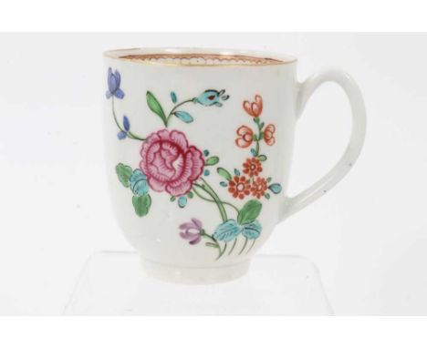 A Worcester coffee cup, circa 1770, boldly painted in polychrome enamels with floral sprays, with gilt rim and pattern to the