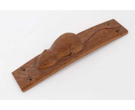 Carved oak furniture mount, in the manner of Robert Mouseman Thompson, of bowed form, 20cm long