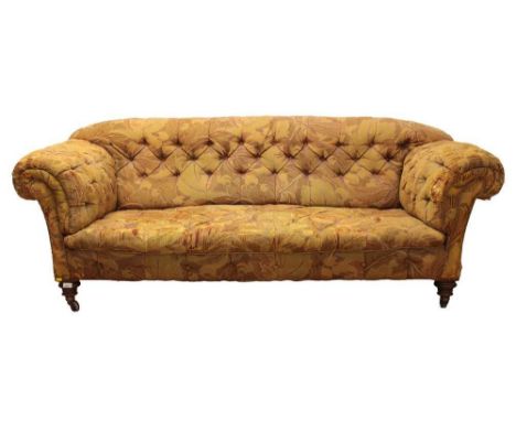 Victorian chesterfield sofa, typically button upholstered form on turned legs and castors, approximately 210cm long