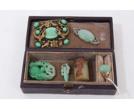 Group jade/ green hard stone jewellery to include a seal, two carvings, marcasite brooch, gilt metal and green glass dragon b