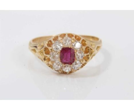 Victorian ruby and diamond cluster ring with a mixed cut ruby measuring approximately 4.4mm x 3.8mm surrounded by eight old c