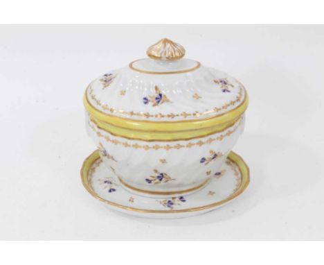 A Chamberlain's Worcester sucrier and cover and teapot stand, circa 1800, of fluted form, decorated with floral sprays and ye