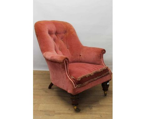 Early Victorian button back easy chair, fully upholstered in pink velvet, raised on bulbous turned legs, the casters stamped 