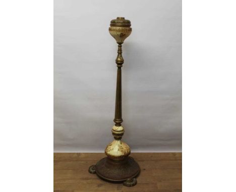 Early 20th century brass and pottery telescopic tall floor standing lamp, with gilt ornamented blush ivory fittings, on circu