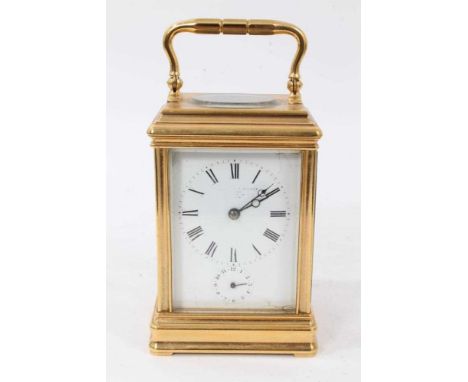 Late 19th century French brass carriage clock by Alfred Drocourt of Paris retailed by The Goldsmiths Alliance in gorge shape 