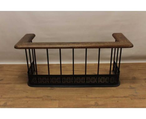 Oak and iron club fender, with oak rail raised on square supports and pierced frieze, total size 132cm wide x 52cm deep x 57c