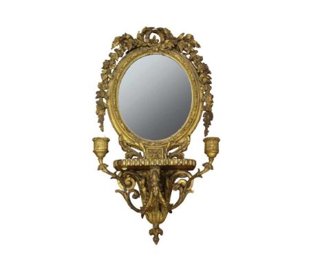 Victorian gilt gesso girondale with oval plate within ornate foliate and ribbon crestings, with shelf below and twin scrollin