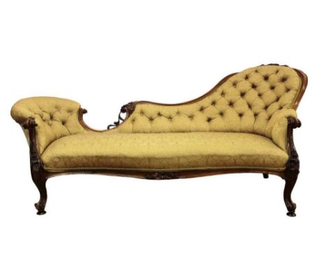 Good quality Victorian carved walnut chaise longue, with floral damask button upholstery in showwood frame with foliate detai