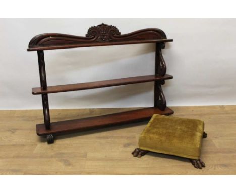 William IV mahogany hanging wall shelf, with carved cresting and three graduated shelves and scrolled supports, 89cm wide, to