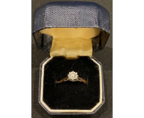 An 18ct gold and platinum illusion set diamond solitaire ring, size J/K, 2.1g, boxed 