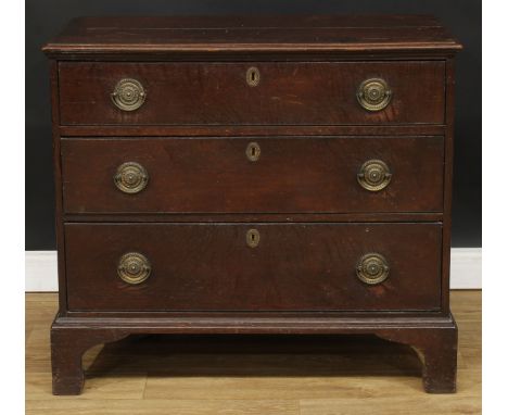 A George III oak chest, rectangular top above three long graduated drawers, brass handles, skirted base, bracket feet, 83cm h
