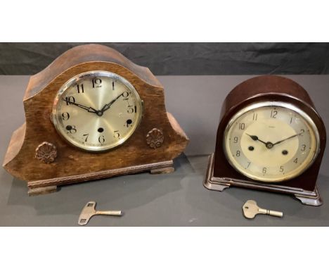 A mid-twentieth century Bakelite Enfield domed mantel clock, Arabic numerals, striking on a bell, twin winding holes, key and