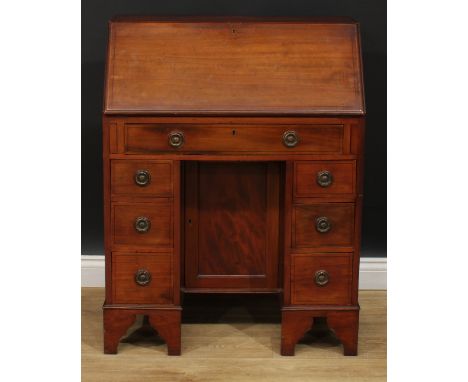 An Edwardian mahogany kneehole bureau, of George III design, ring handles, bracket feet, 99cm high, 76cm wide, 43cm deep, c.1