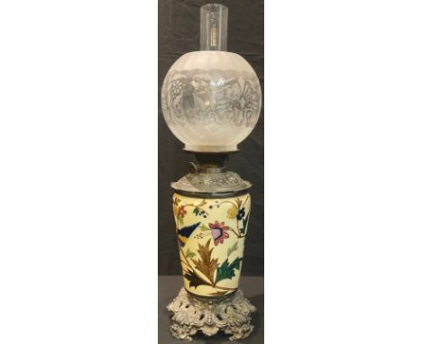 A late 19th century oil lamp, cast metal mounted Staffordshire stoneware ceramic base, Duplex twin burner, acid etched globul
