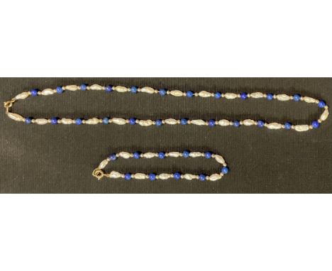 A cultured freshwater pearl and lapis lazuli necklace and bracelet suite, 9ct gold clasps 