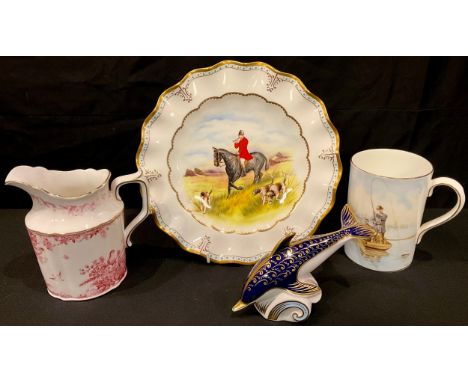 A Royal Crown Derby paperweight, Dolphin, silver stopper; a hunting scene plate, a mug "The Angler", a pink Aves water jug (4