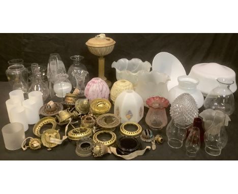 A brass oil lamp, assorted glass lamp shades, some opaque, oil lamp fittings and parts, clear glass lamp chimneys; qty 