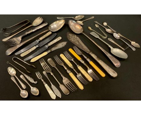 A pair of George V/VI silver sugar bows, Sheffield 1937, three silver teaspoons, 60g; a 19th century silver and mother-of-pea