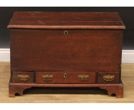 An 18th century oak mule chest, of small proportions, hinged top above three drawers, skirted base, bracket feet, 53cm high, 