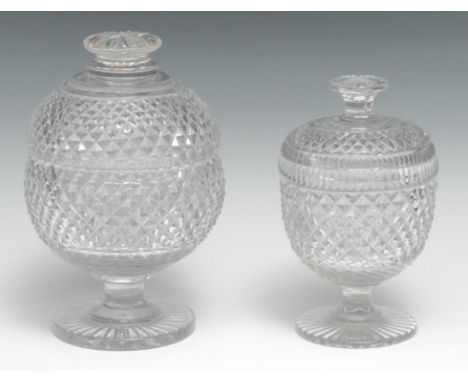 An early 20th century heavy strawberry cut glass sugar box and cover, star cut flattened button finial and base, 19.5cm high;