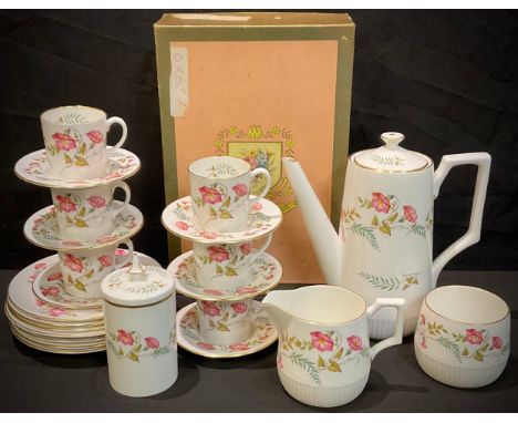 An Abbeydale coffee set for six, printed with trailing pink trumpet shaped flowers, comprising six coffee cans and saucers, b